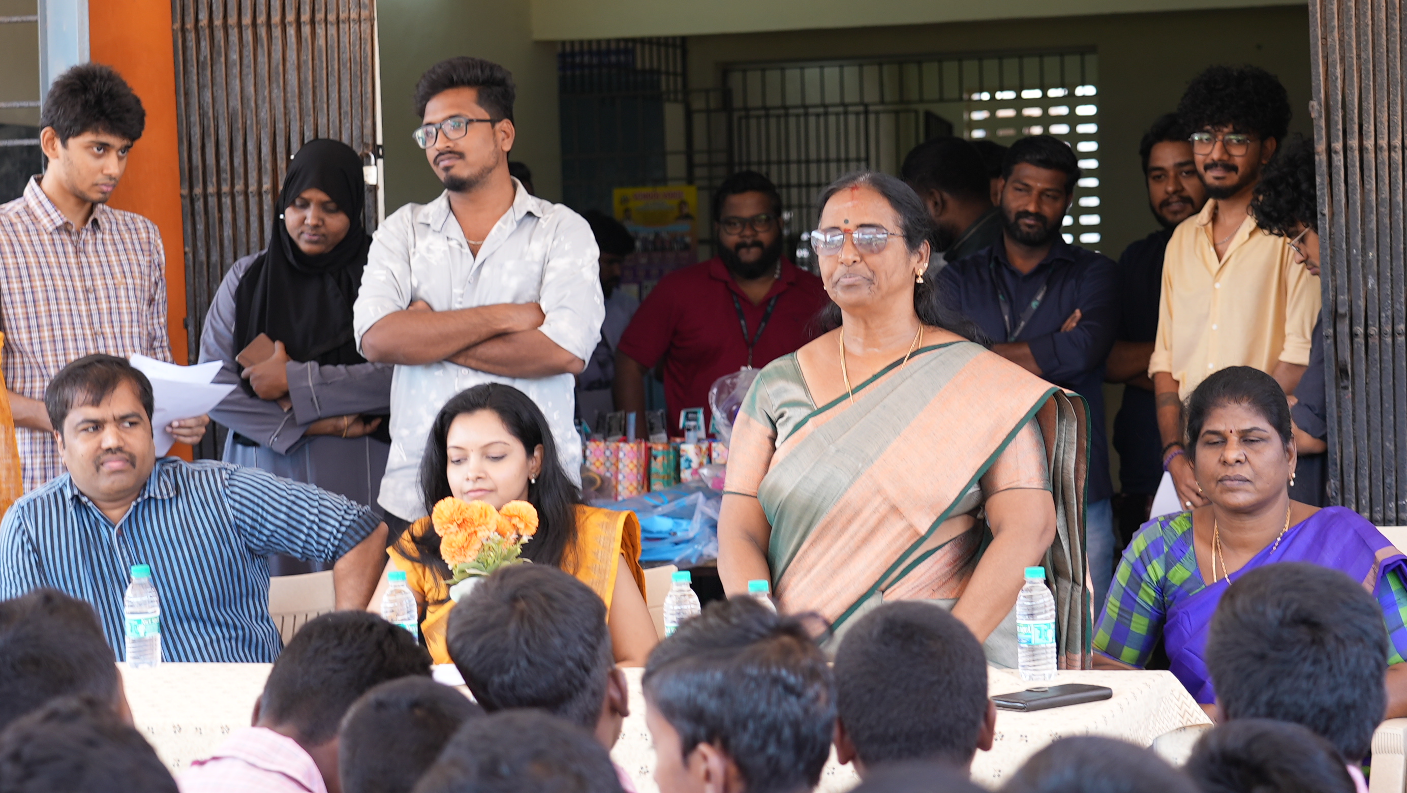Guests and school staff take their seats as the orientation ceremony begins