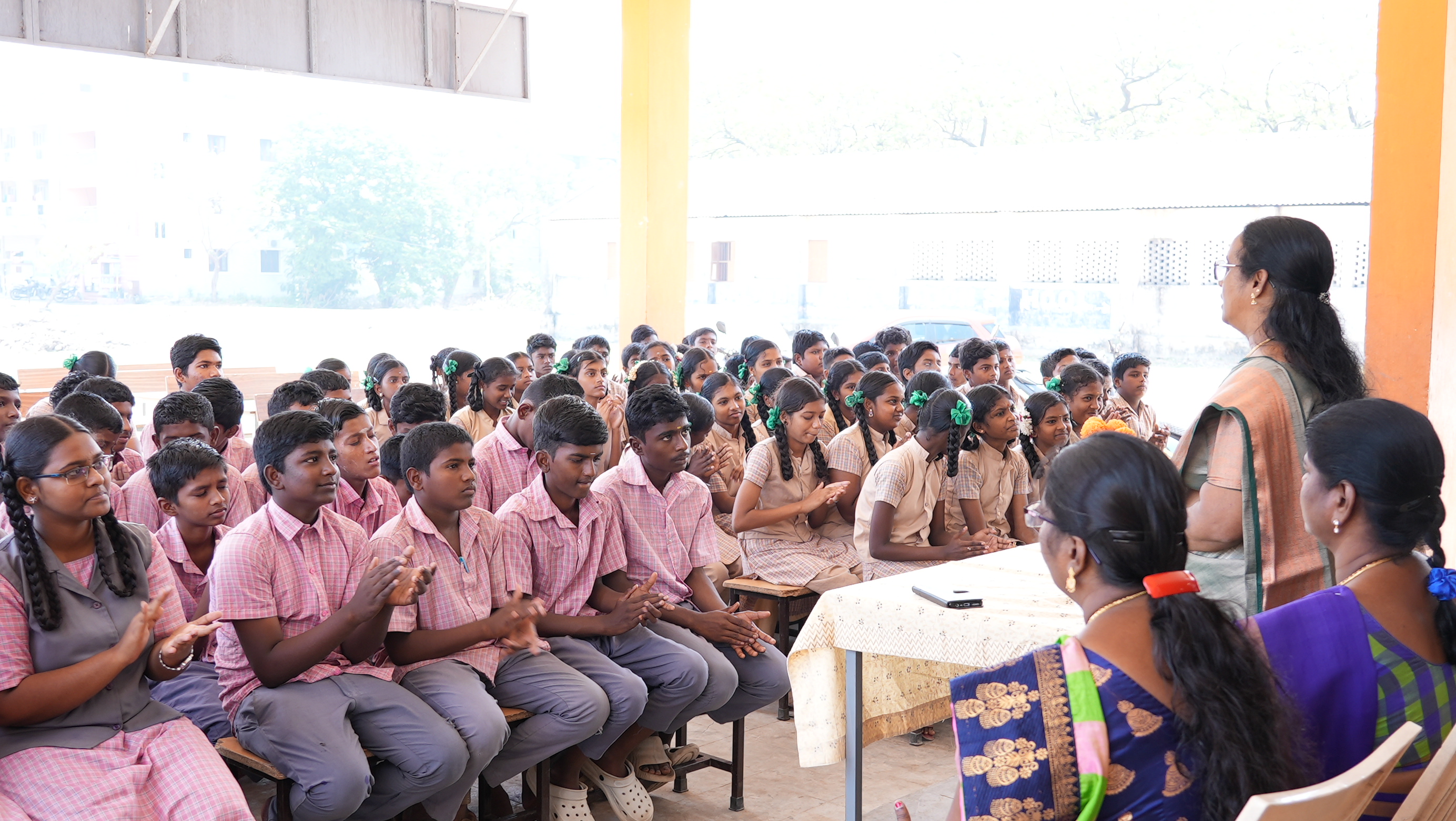 Students applaud during the program orientation