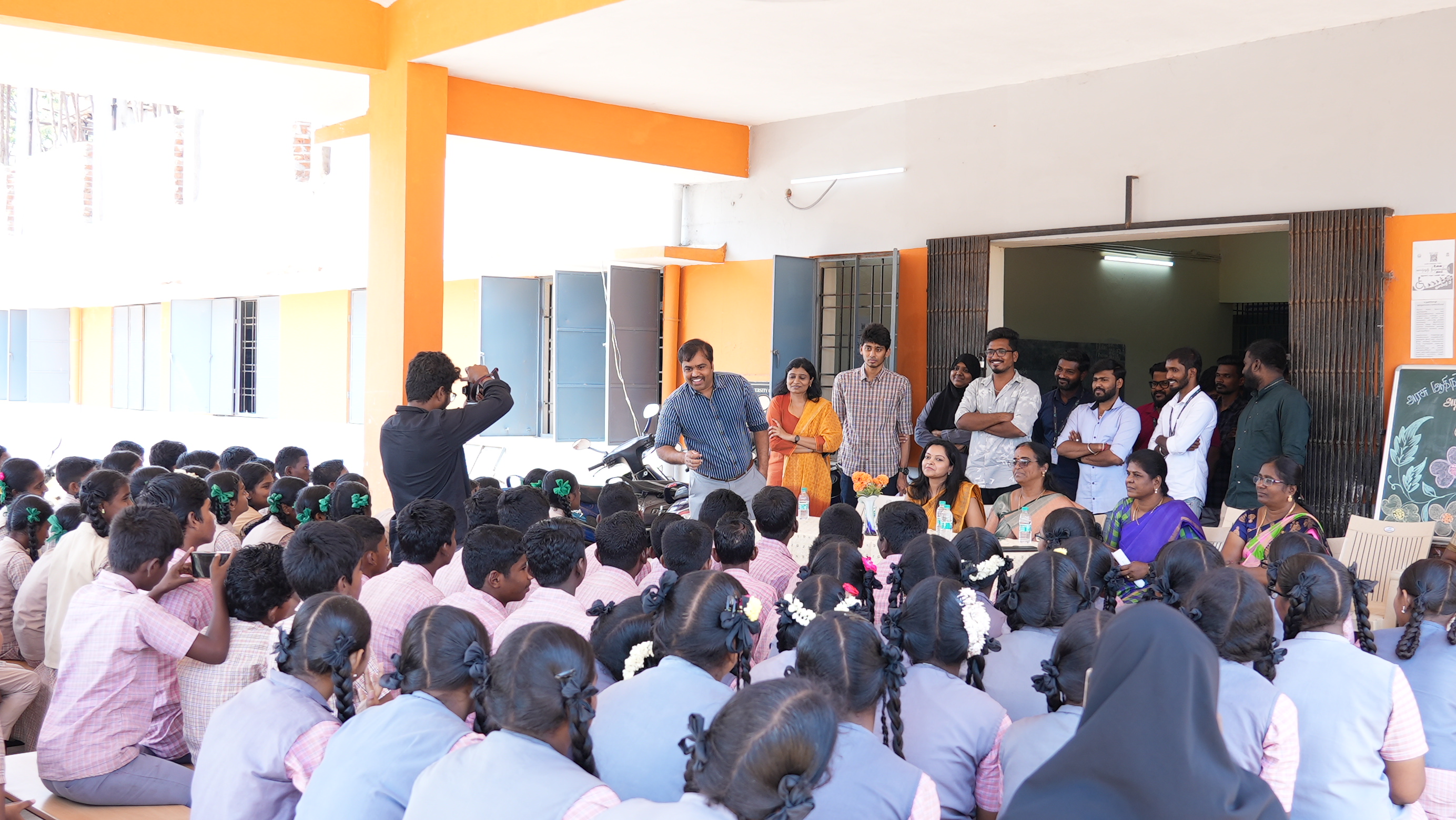 The team addresses the full assembly on the first day