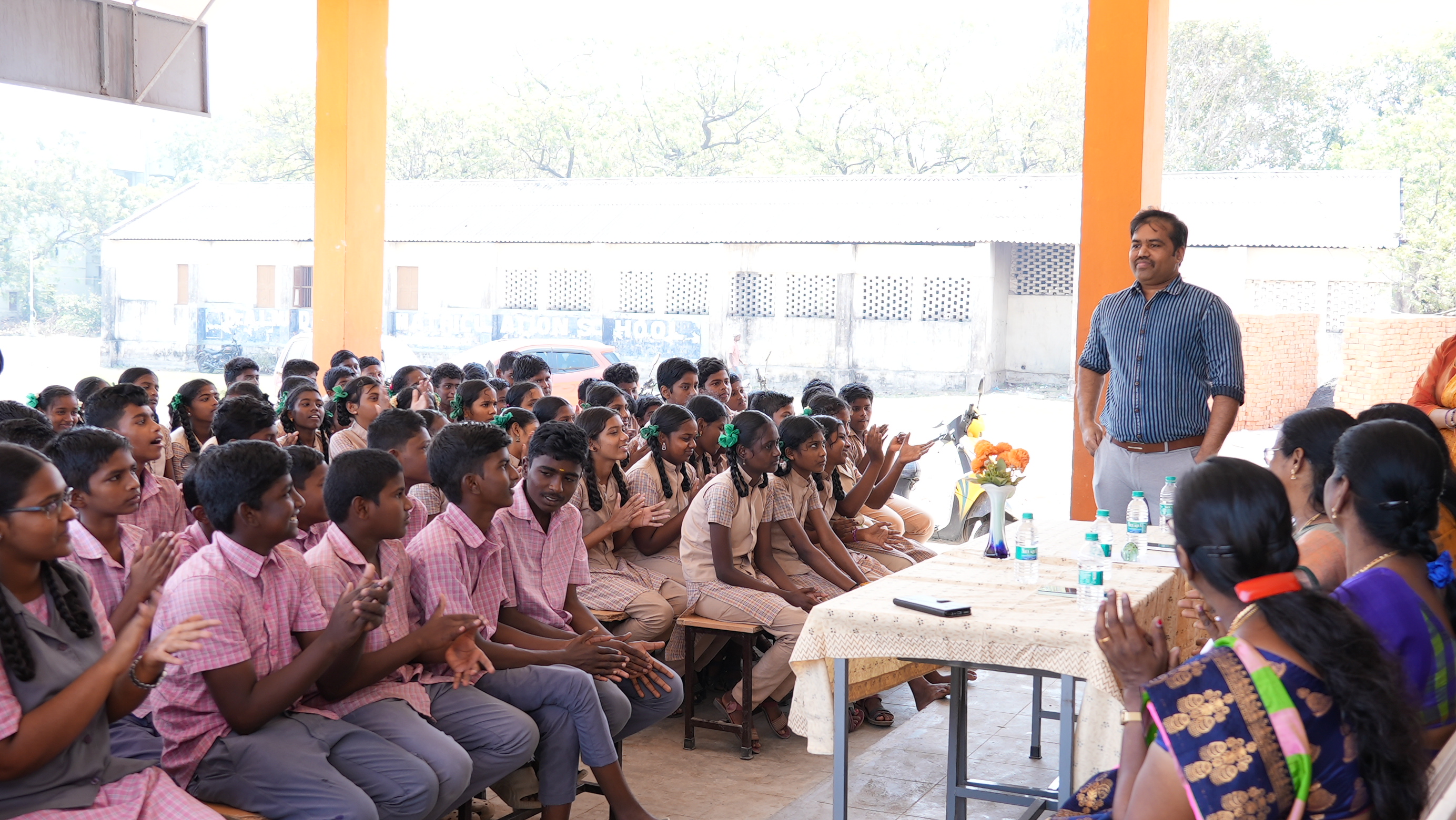 Addressing students and staff at the school assembly