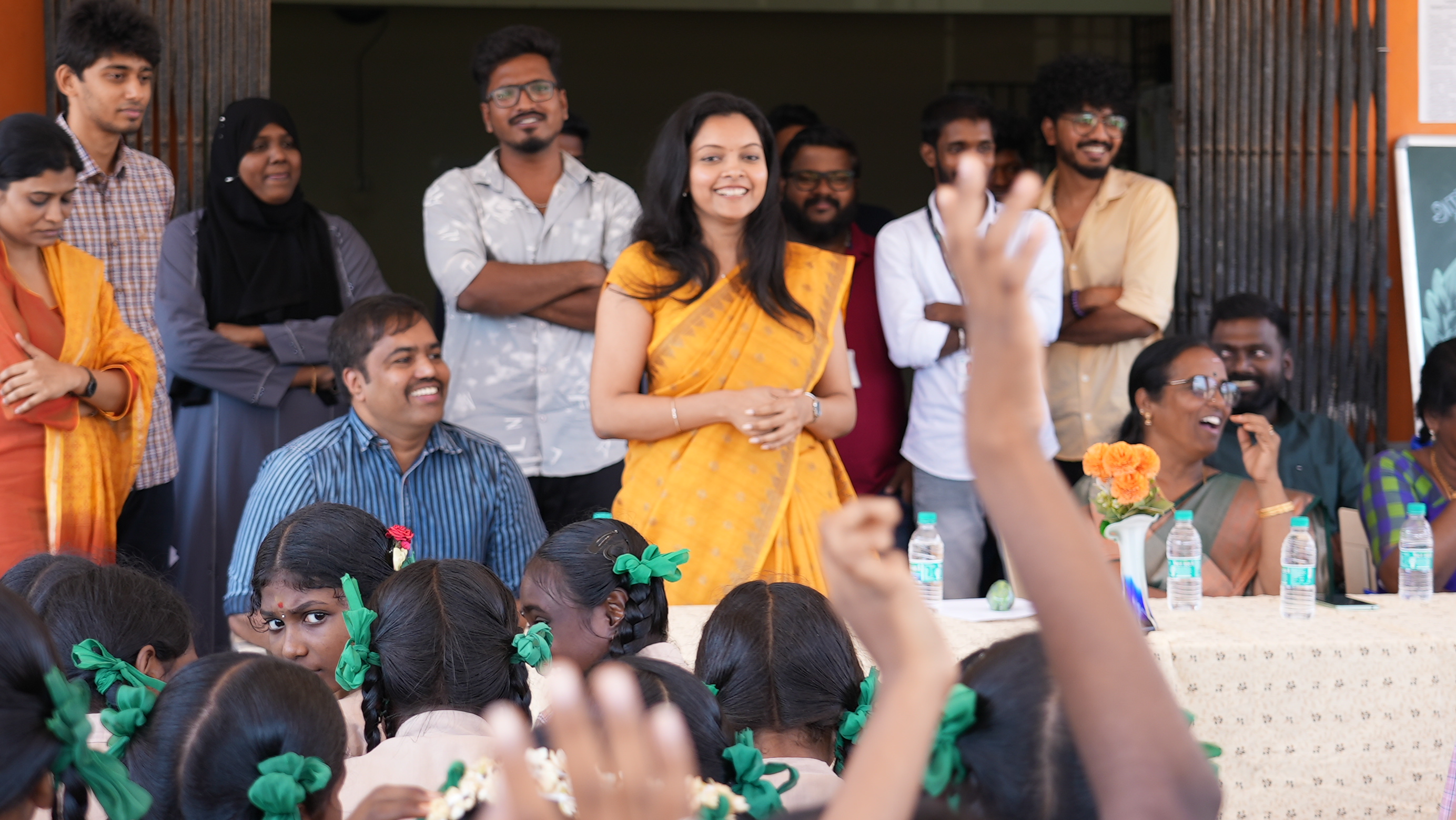 A volunteer speaks with the students during the closing session