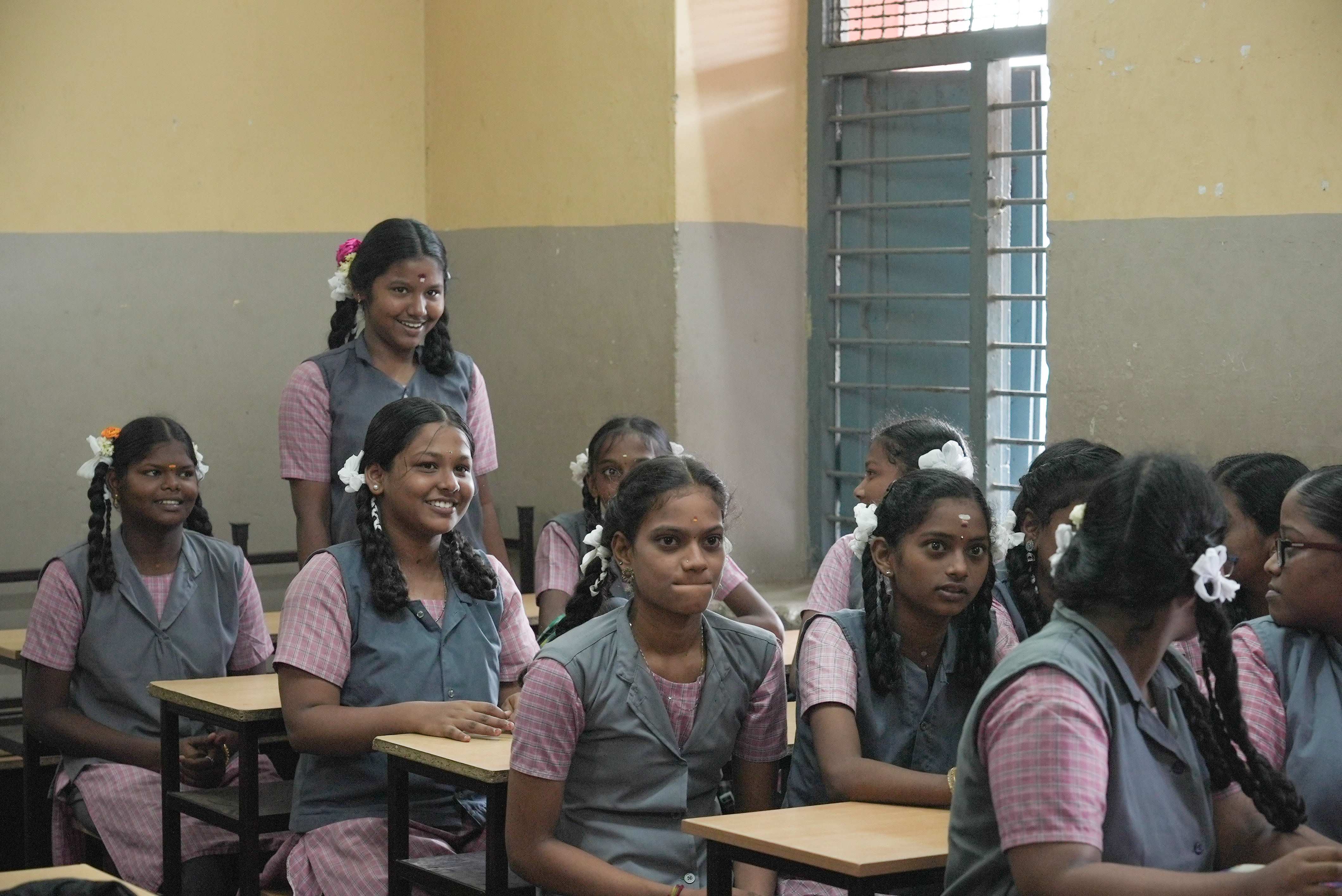 Students share a smile during a classroom session