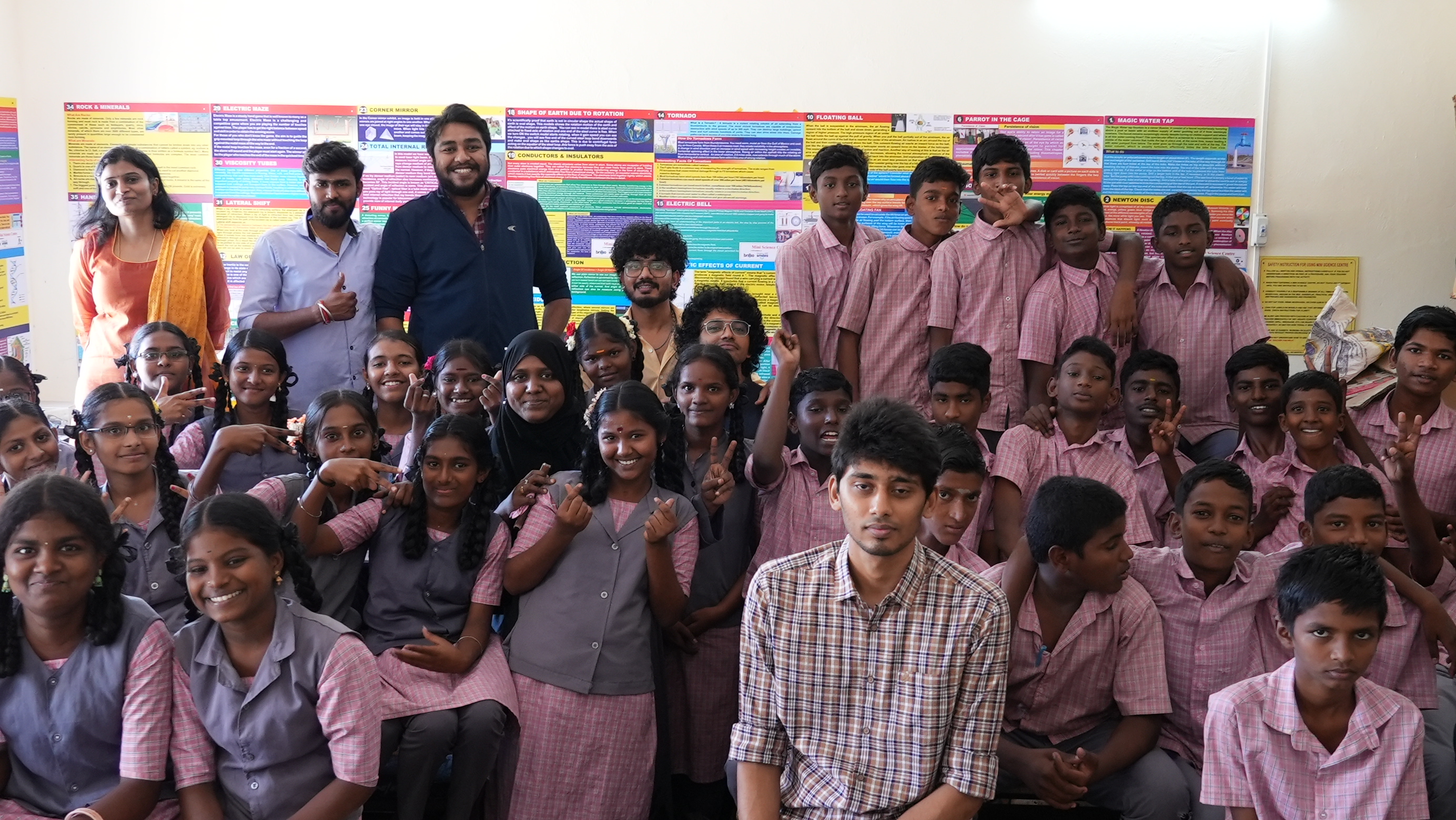 A last group photo with the science lab exhibits in the background