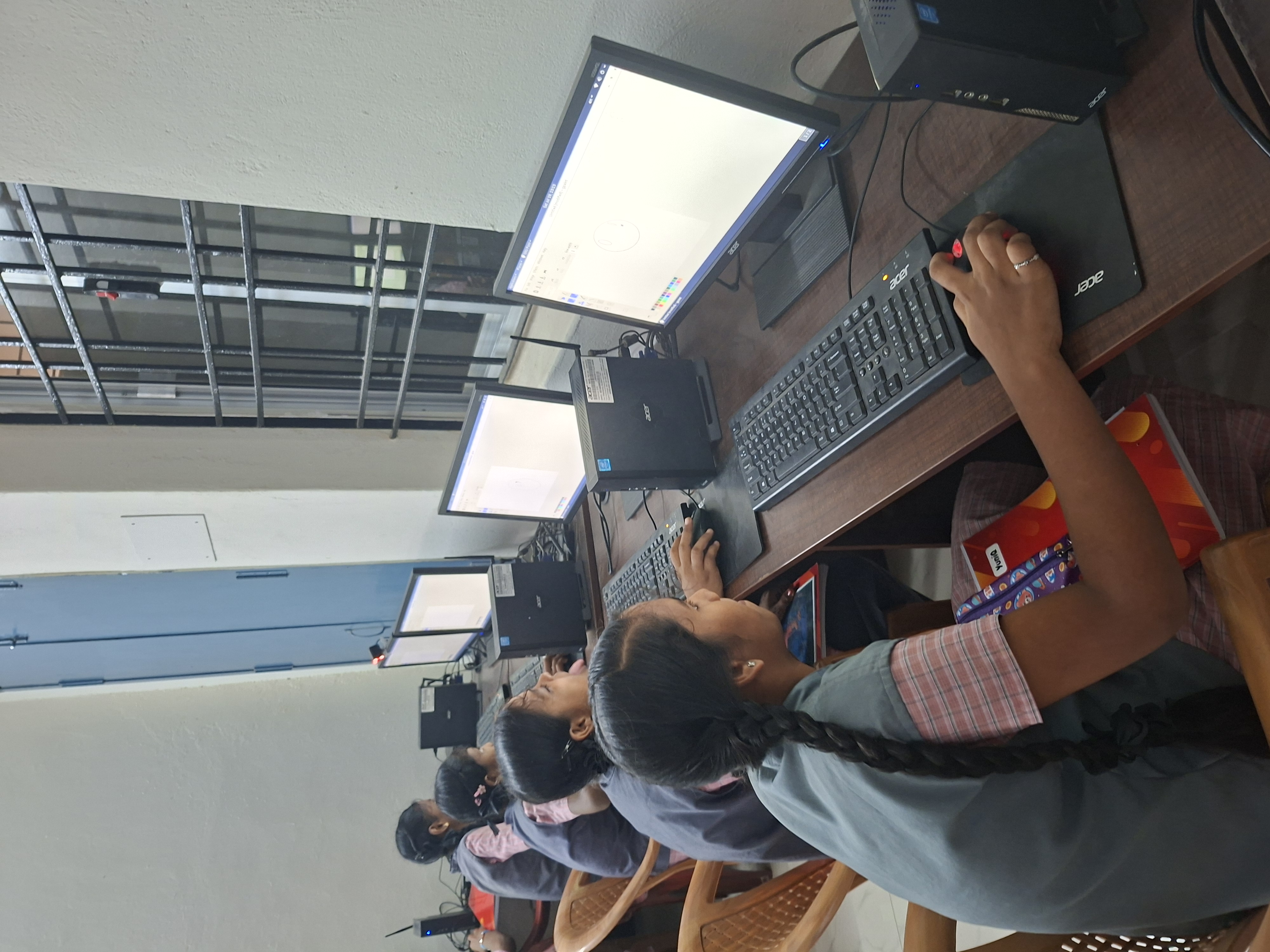 Students work through a hands-on coding worksheet at their desks