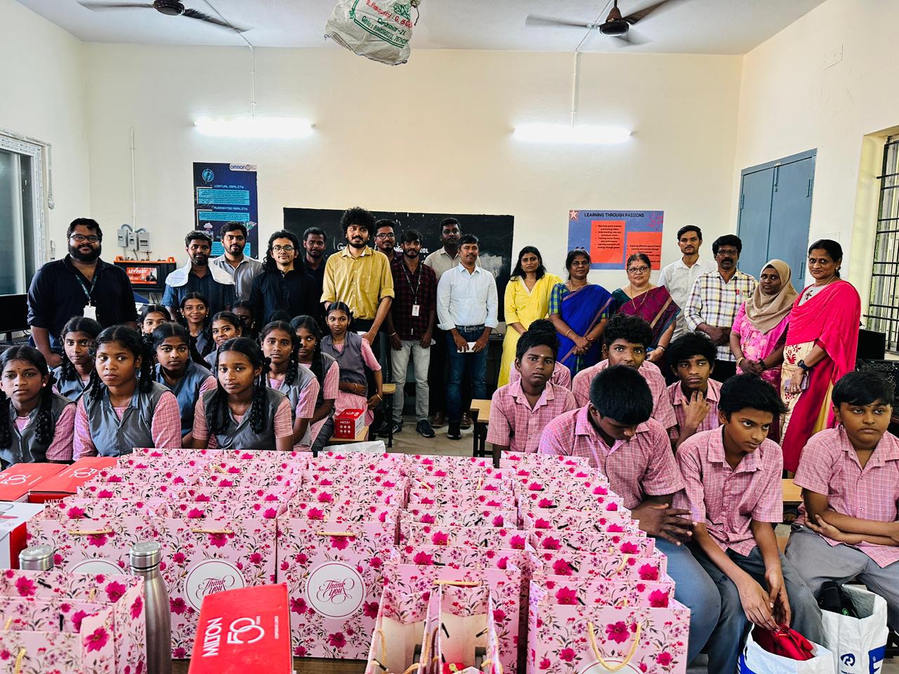 Students, teachers, and volunteers together for the gift distribution ceremony