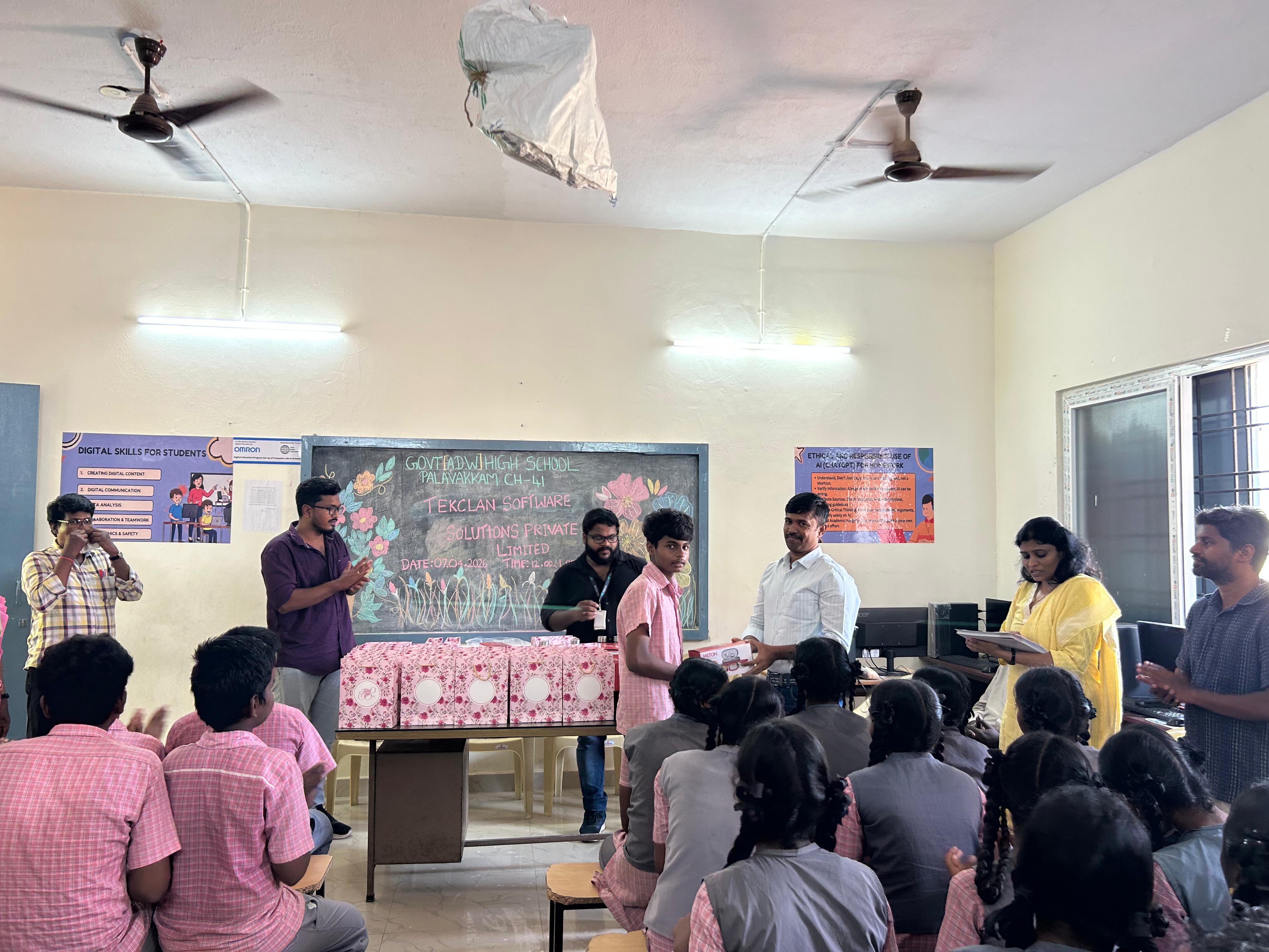 TekClan Software Solutions volunteers distribute gifts at the closing ceremony
