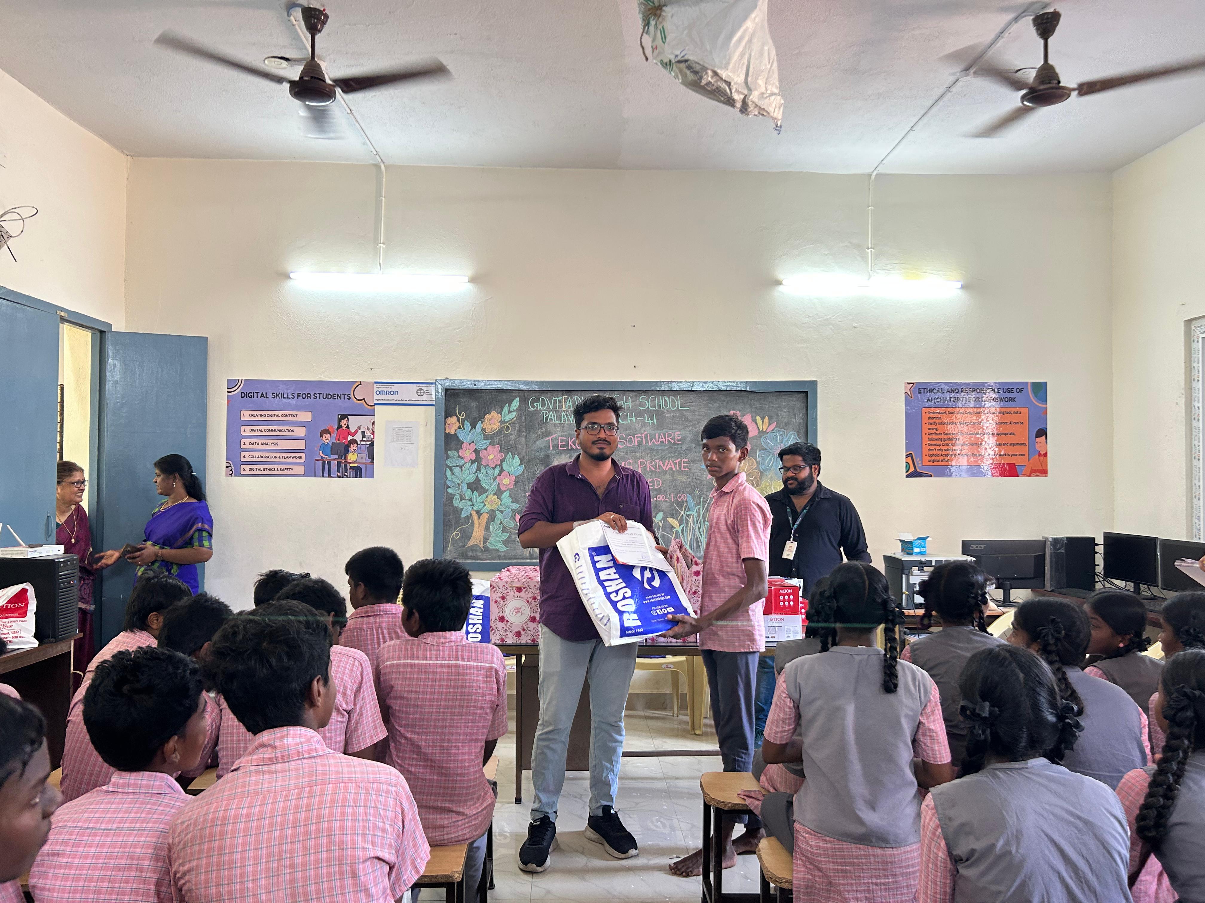 TekClan Software Solutions volunteers distribute gifts at the closing ceremony