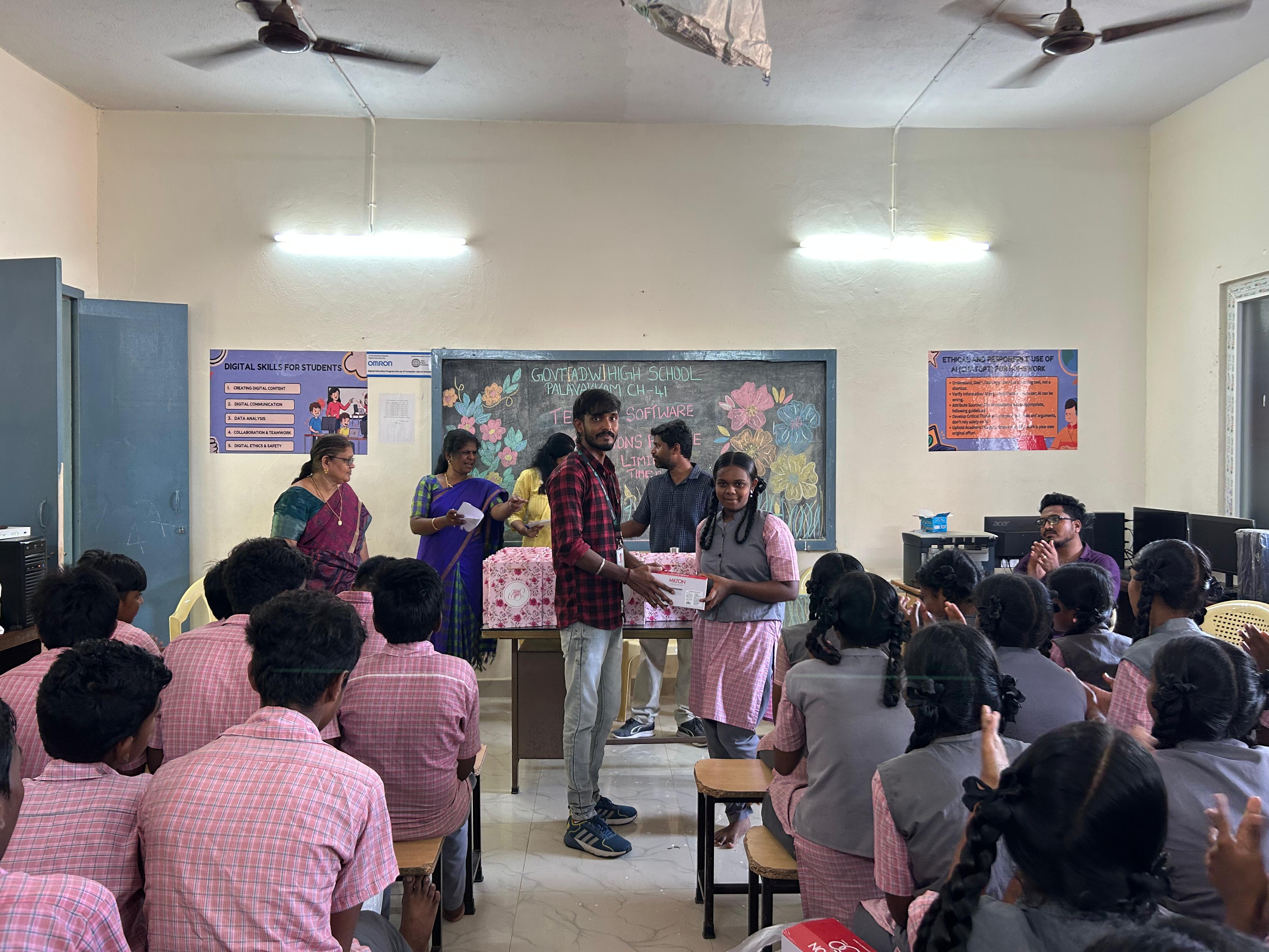 TekClan Software Solutions volunteers distribute gifts at the closing ceremony