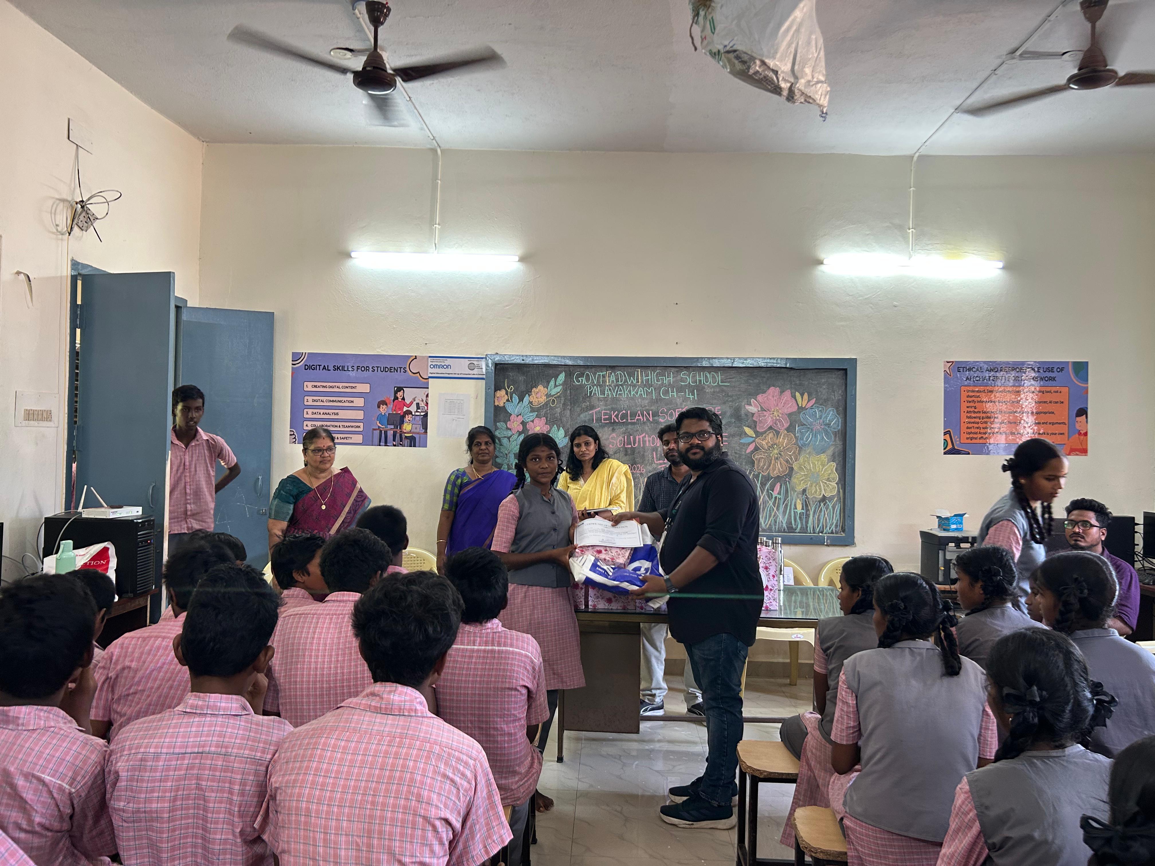 TekClan Software Solutions volunteers distribute gifts at the closing ceremony